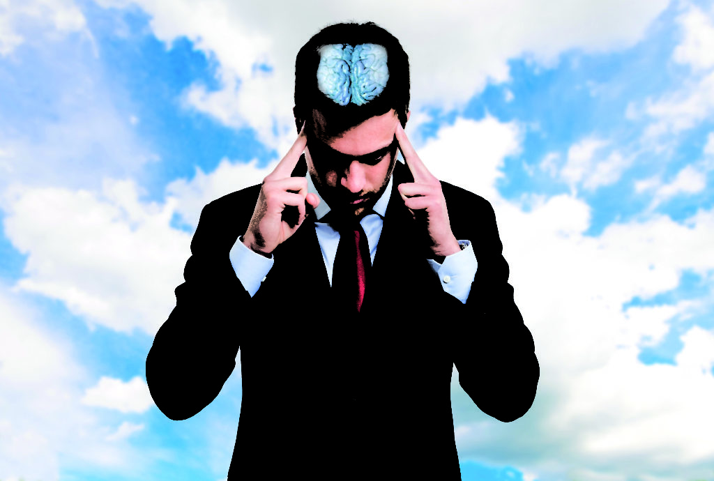 Concentrated businessman trying to focus his mind